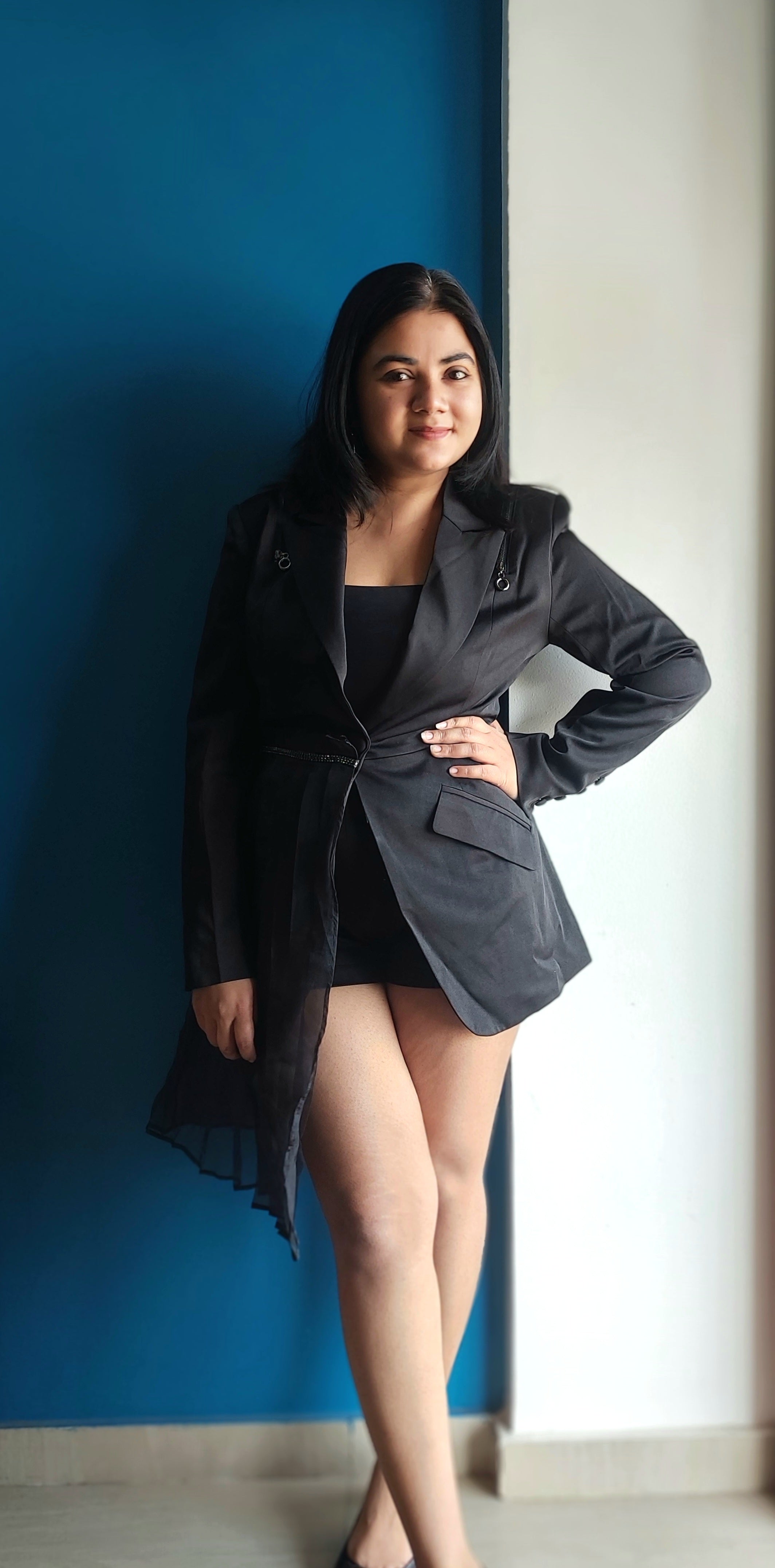 Influncer wearing Black women's blazer co-ord set with sheer overlay and high-waisted shorts