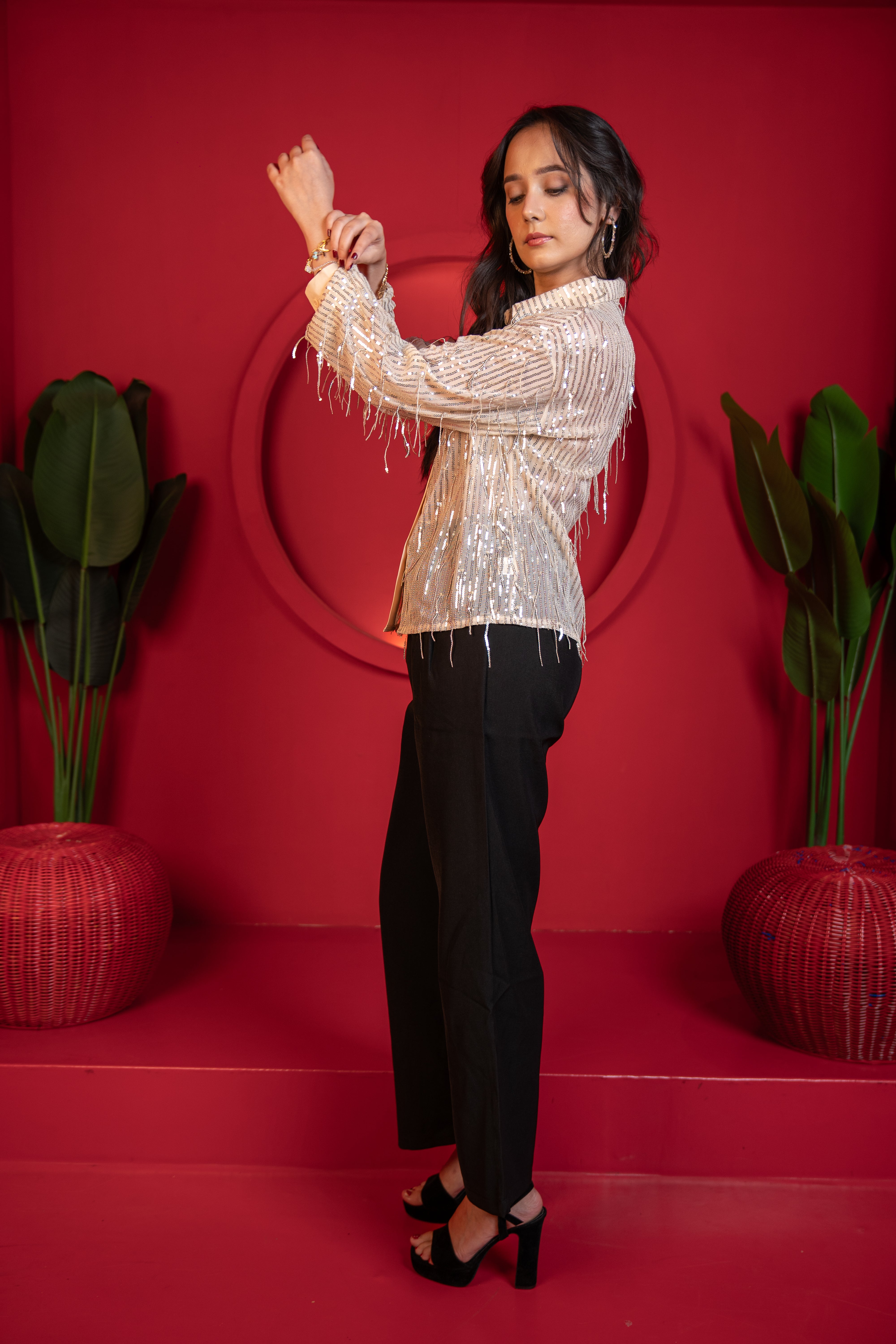 Woman wearing beige tasselled shirt