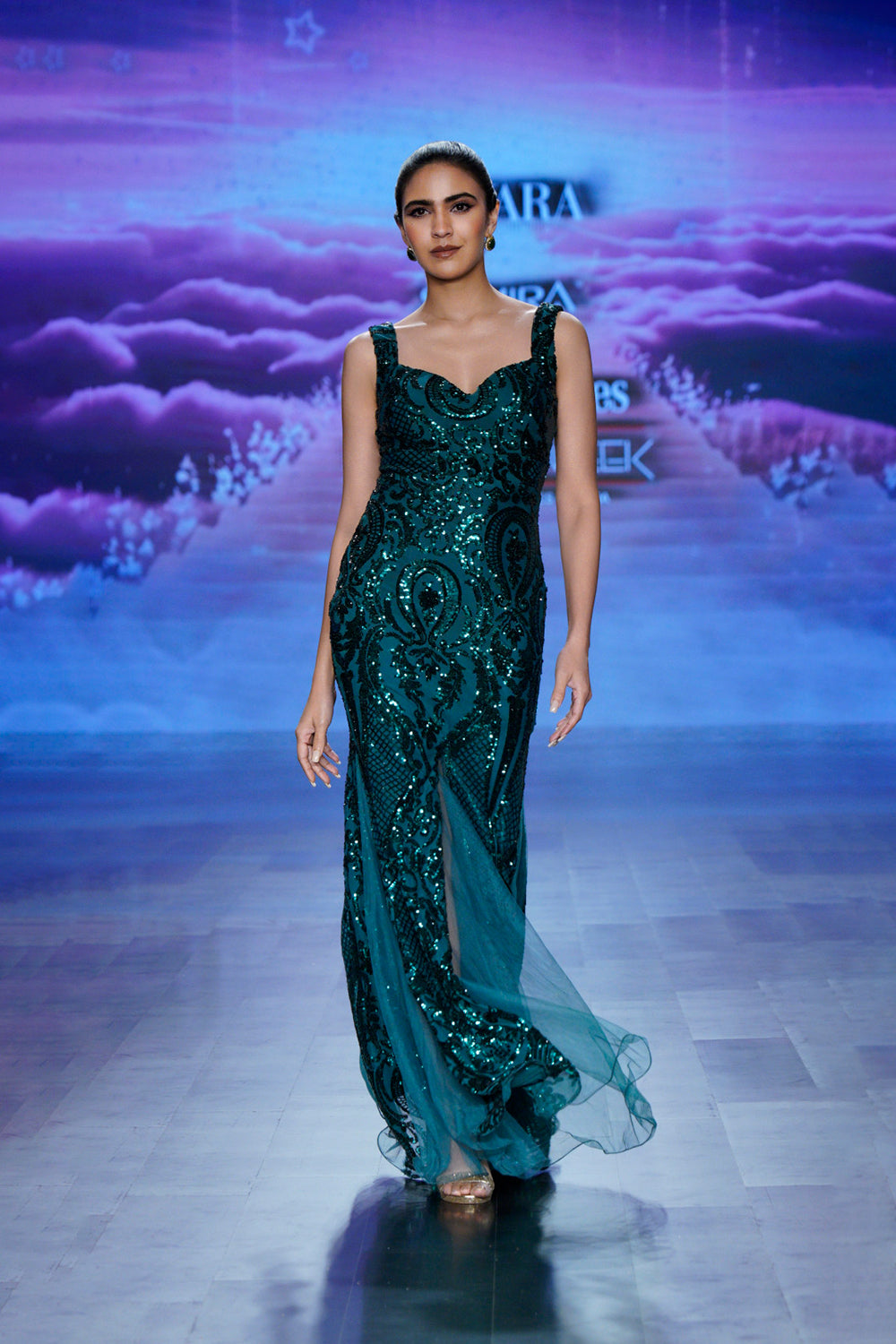 Emerald green sequin gown with sweetheart neckline. (front profile)