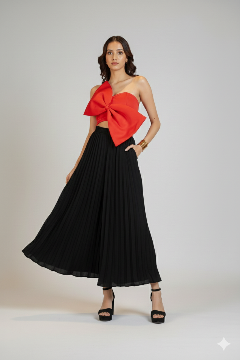 women wearing flowing black pleated trousers