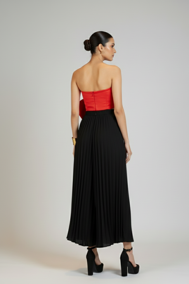 back angle of women wearing black pleated trousers