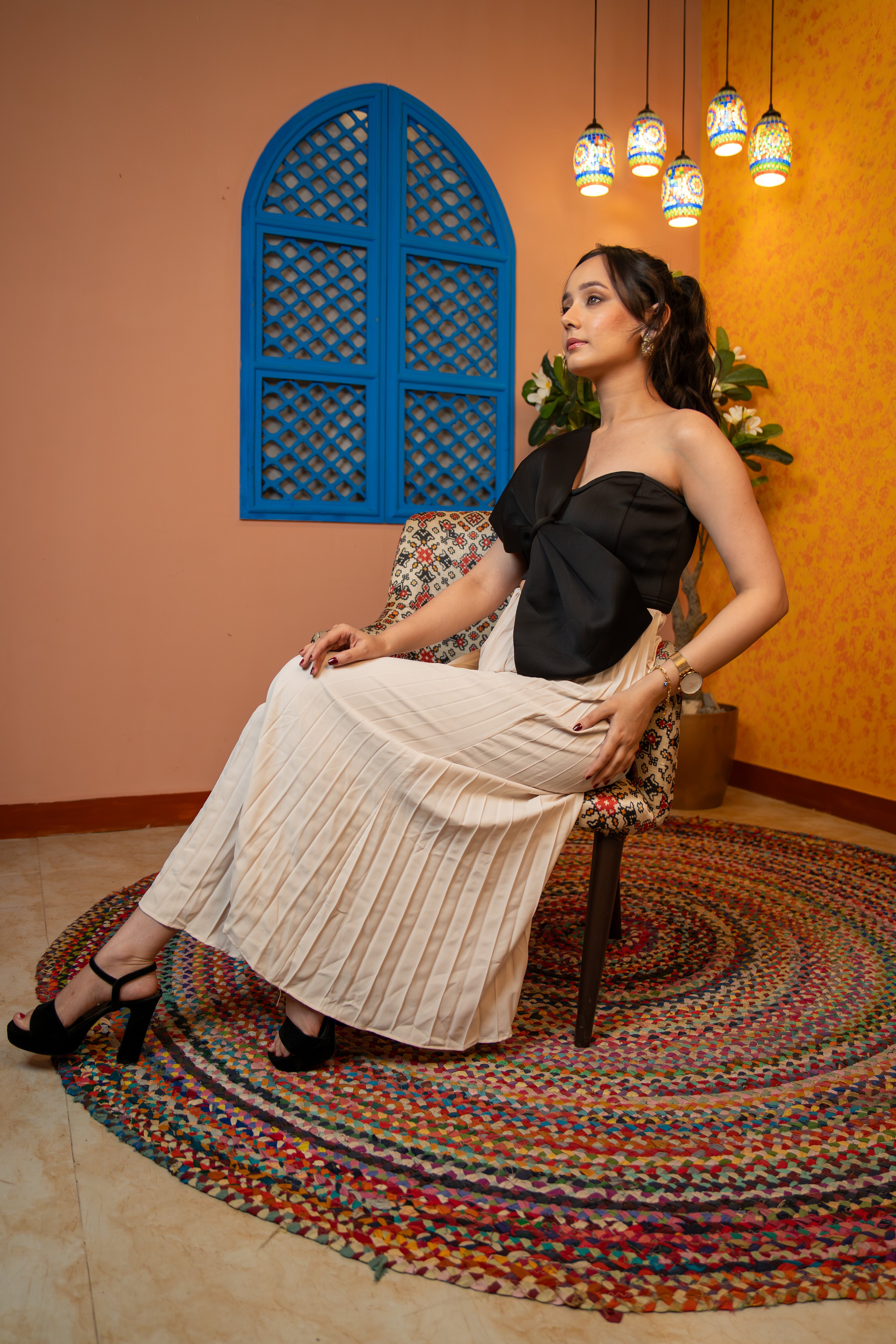 right profile of woman wearing Midnight black bow crop top with corset fit