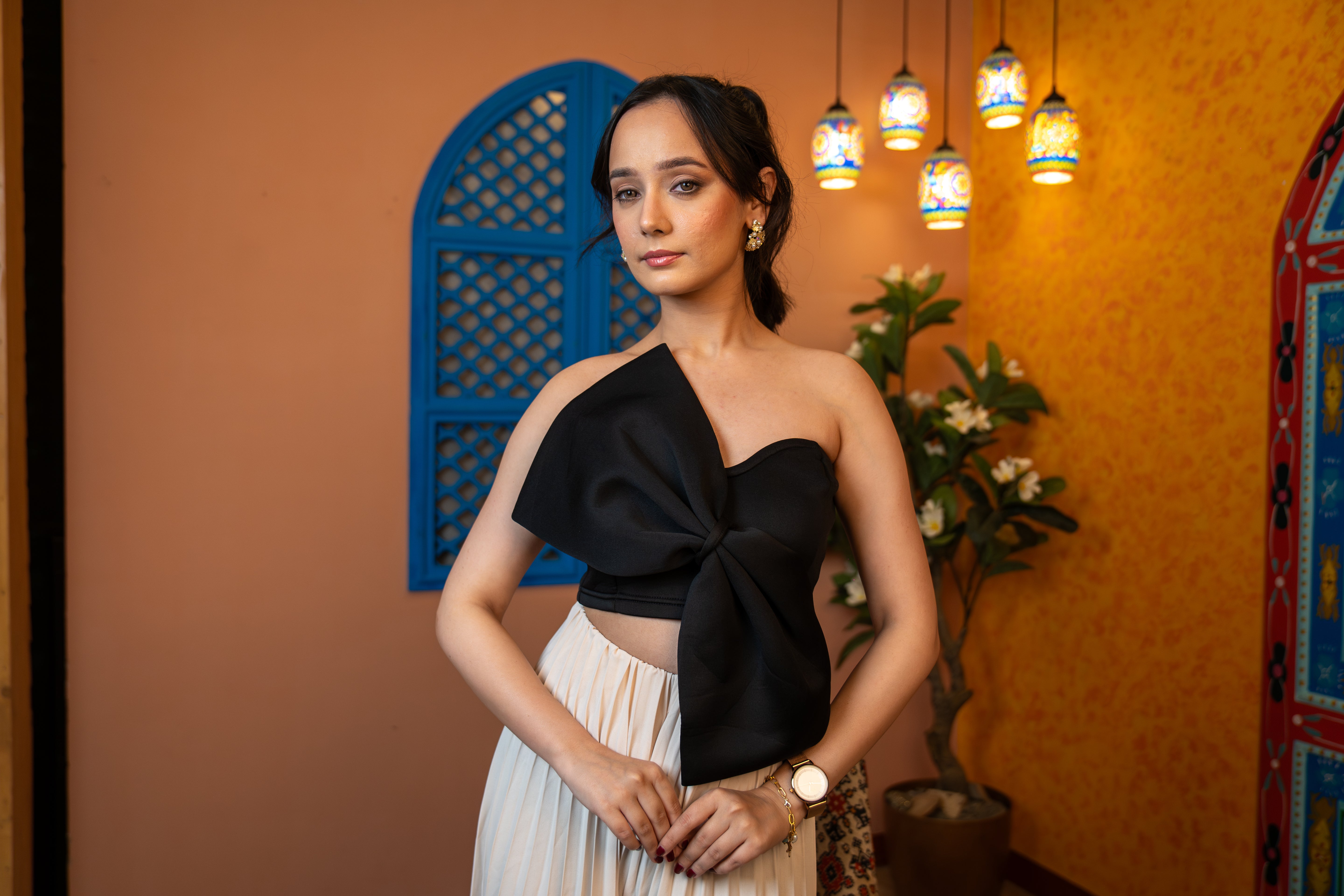 woman wearing High-fashion black crop top with bold structure