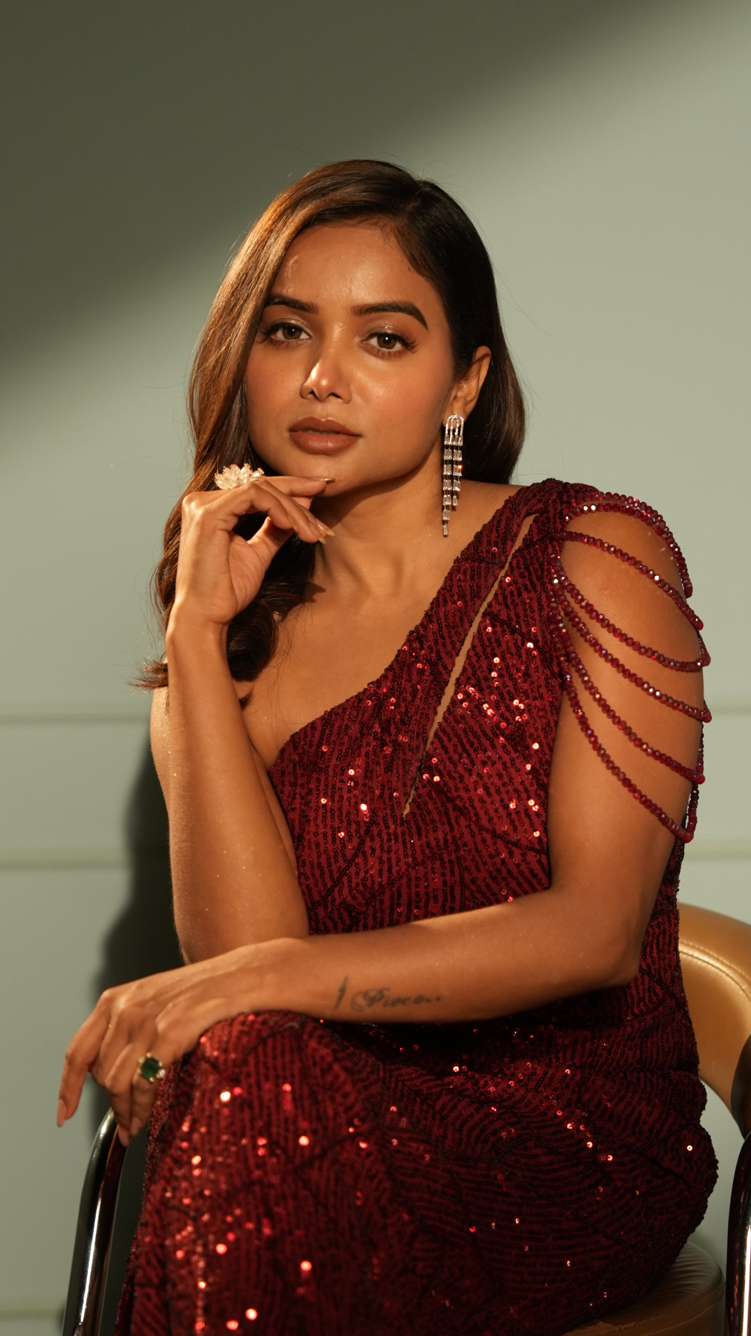 Woman wearing a One-Shoulder Red Sequin Dress.