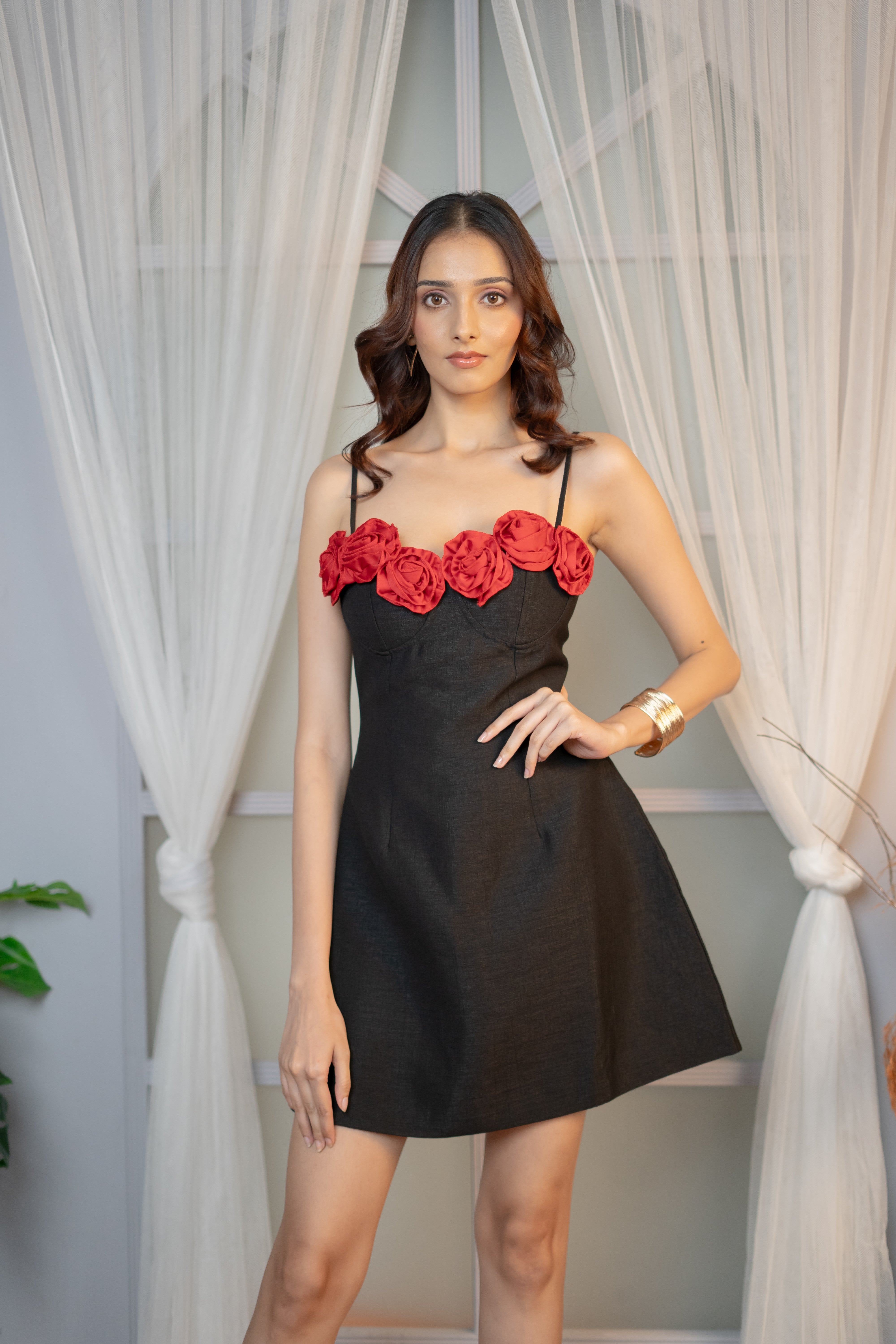 Black A-line dress with red floral embroidery (front profile)
