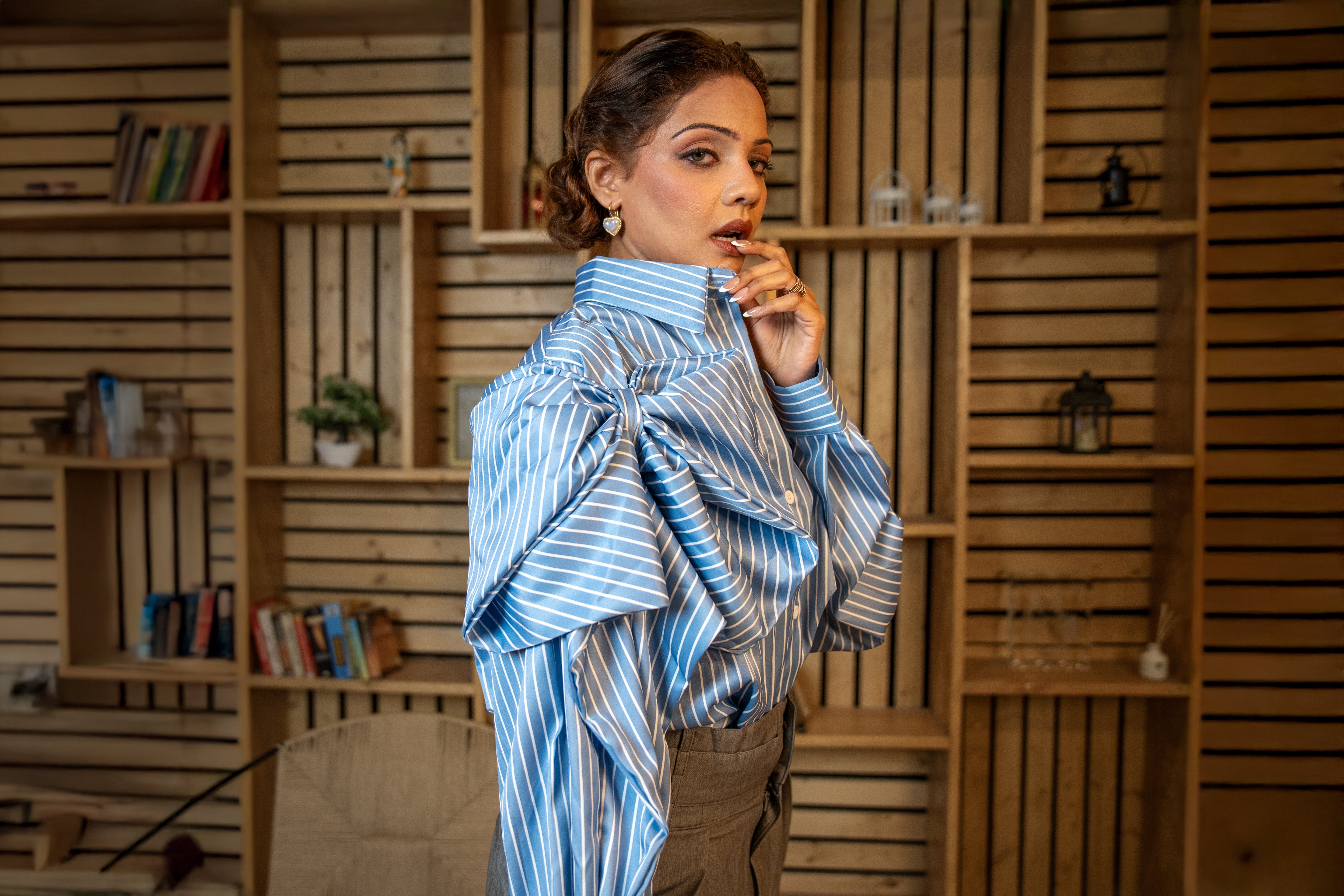 Front view of striped blouse with dramatic bow collar