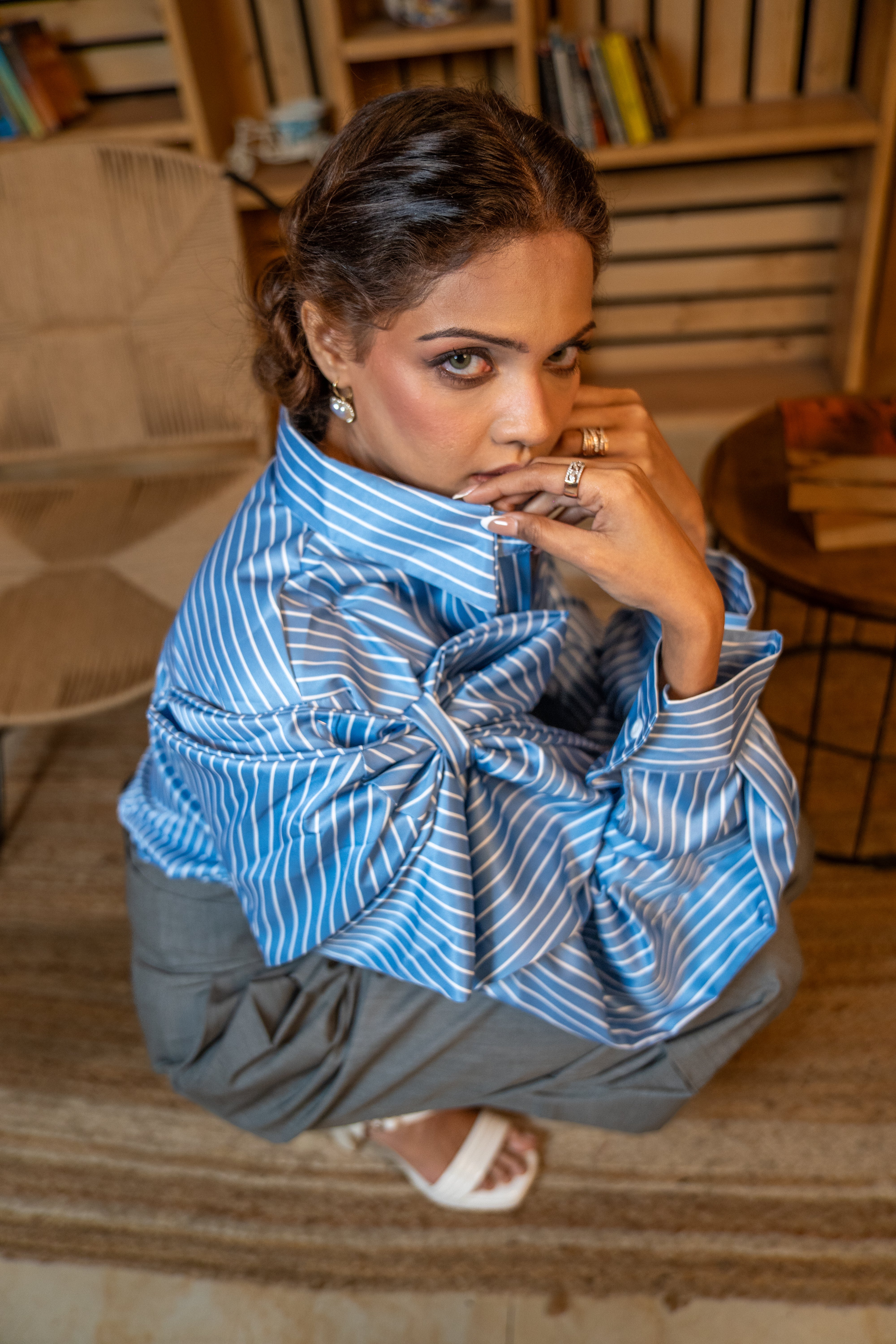 Front view of striped blouse with dramatic bow collar