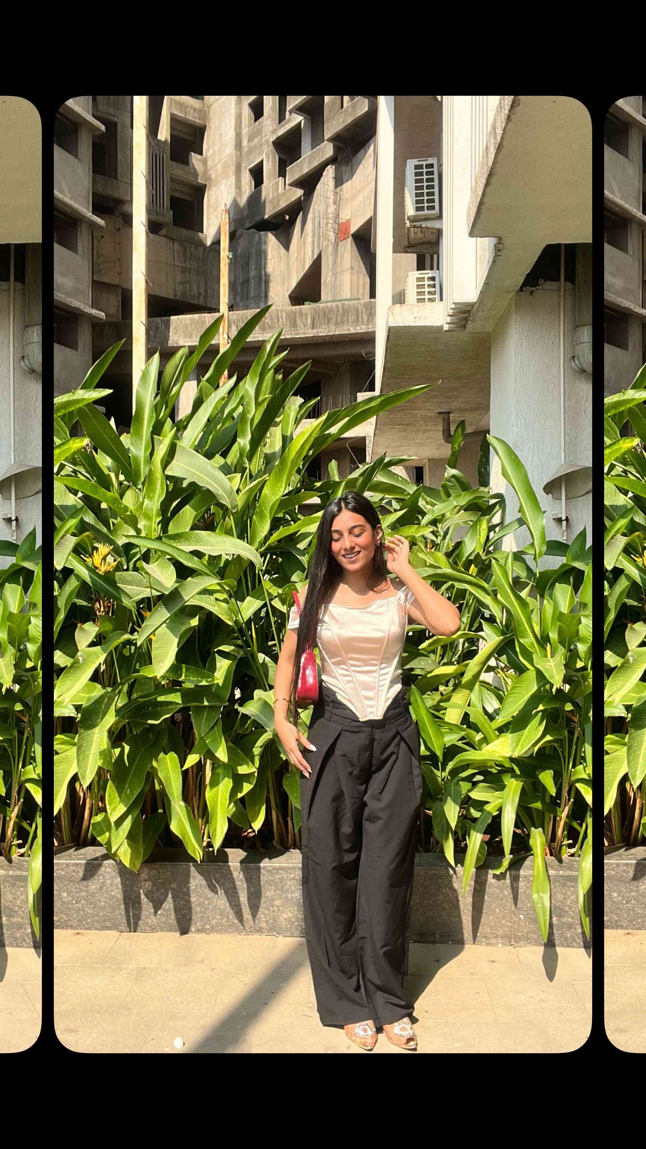 woman wearing a golden corset top and black flared trousers